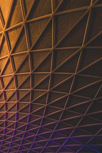 iphone backgrounds A meshwork of steel beams on an illuminated facade iphone wallpapers